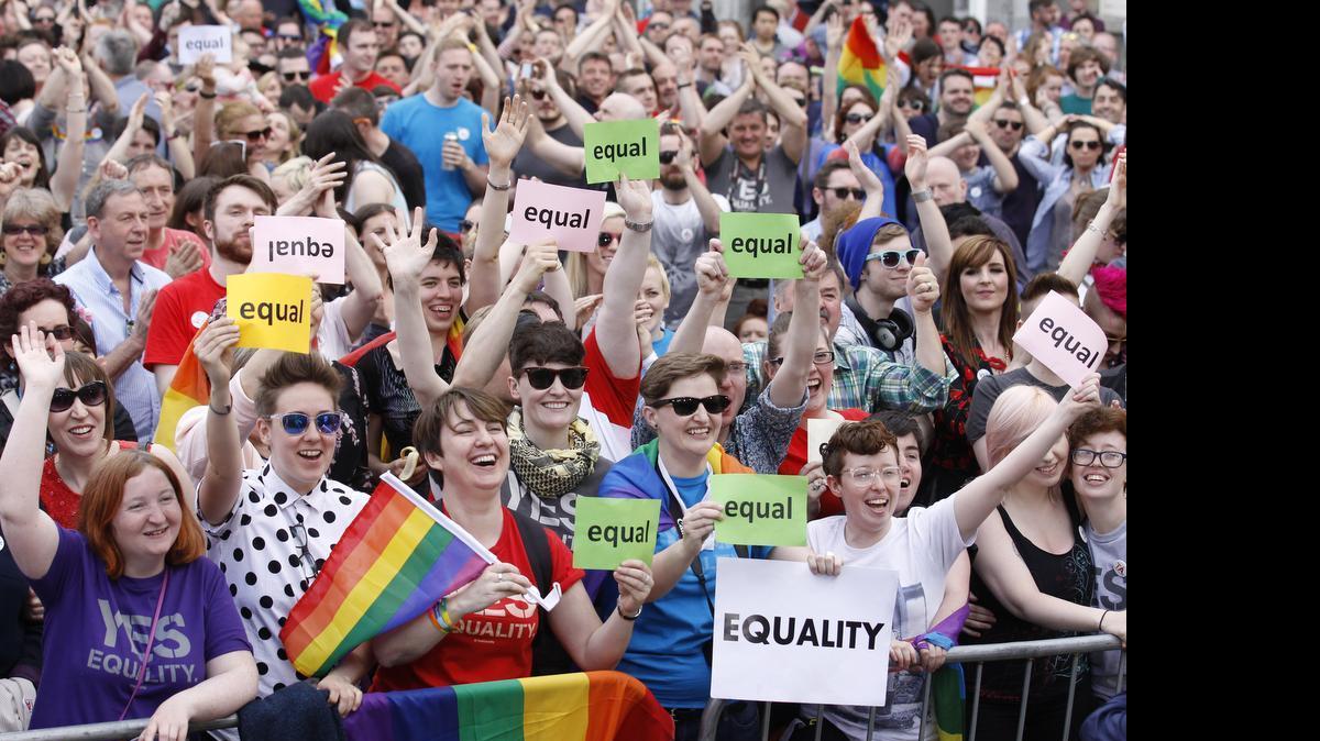 
Yes supporters celebrate after as the first results start to filter through in the Irish referendum in Dublin, Ireland, Saturday, May 23, 2015. Ireland has voted resoundingly to legalize gay marriage in the world's first national vote on the issue, leaders on both sides of the Irish referendum declared Saturday even as official ballot counting continued. Senior figures from the "no" campaign, who sought to prevent Ireland's constitution from being amended to permit same-sex marriages, say the only question is how large the "yes" side's margin of victory will be from Friday's vote.
