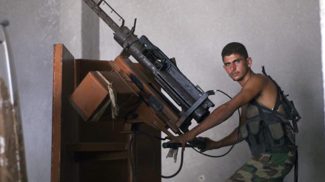 An Ahrar al Sham fighter manned an anti-aircraft gun in a photo taken in August 2012.