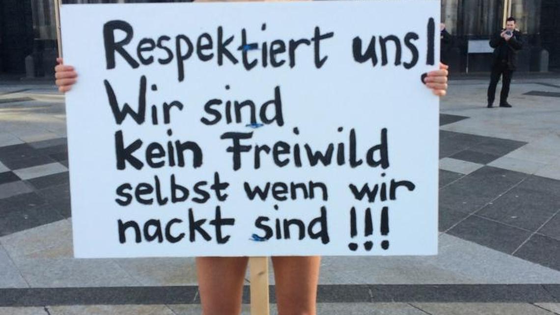 A Swiss performance artist disrobed outside Cologne’s cathedral on Friday to protest alleged sexual assaults perpetrated on New Year’s Eve. Her sign reads “Respect us! We are not fair game even when we are naked!!!” Police announced that they’d arrested two young asylum seekers in what is now 200 reported assaults during New Year’s Eve mayhem near the cathedral.
