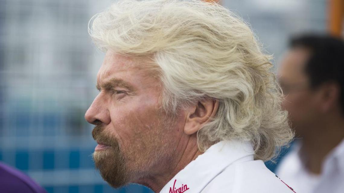 Virgin Group founder Richard Branson approaches the winner's circle after team driver Sam Bird won the New York City ePrix a Formula E all-electric auto race Saturday, July 15, 2017, in the Brooklyn borough of New York.