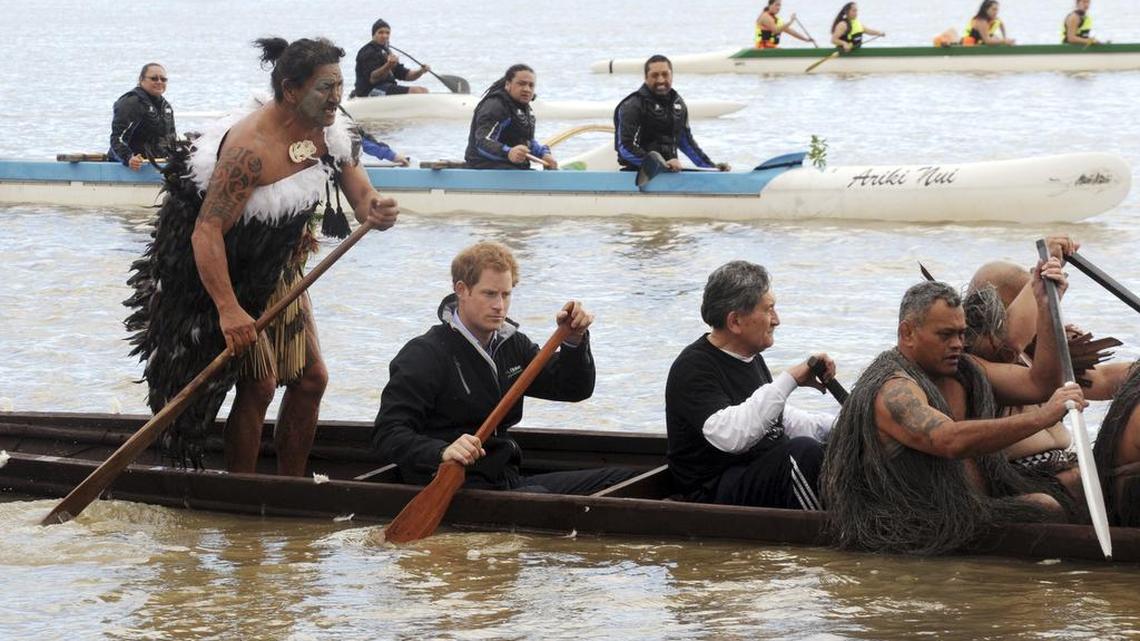 Britain's Prince Harry, second from left, front, helps to paddle a Maori waka (canoe) down the Whanganui River in Wanganui, New Zealand, Thursday, May 14, 2015.