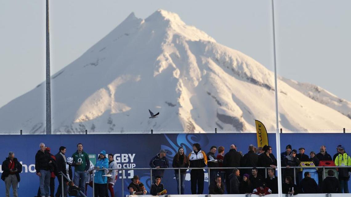 Mount Taranaki looms New Plymouth, New Zealand.