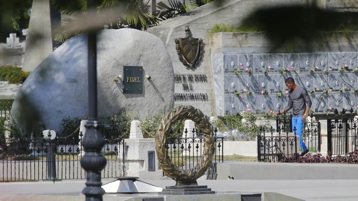 Cubans visit the grave site of Fidel Castro at Cemeterio Santa Ifigenia in Santiago de Cuba on Sunday, December 4, 2016.