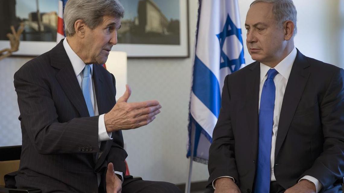 U.S. Secretary of State John Kerry, left, speaks with Israeli Prime Minister Benjamin Netanyahu during a meeting in Berlin, Germany Thursday, Oct. 22, 2015. Kerry and Netanyahu called Thursday for an immediate end to incitement blamed for a recent deadly wave of Palestinian attacks against Israelis.