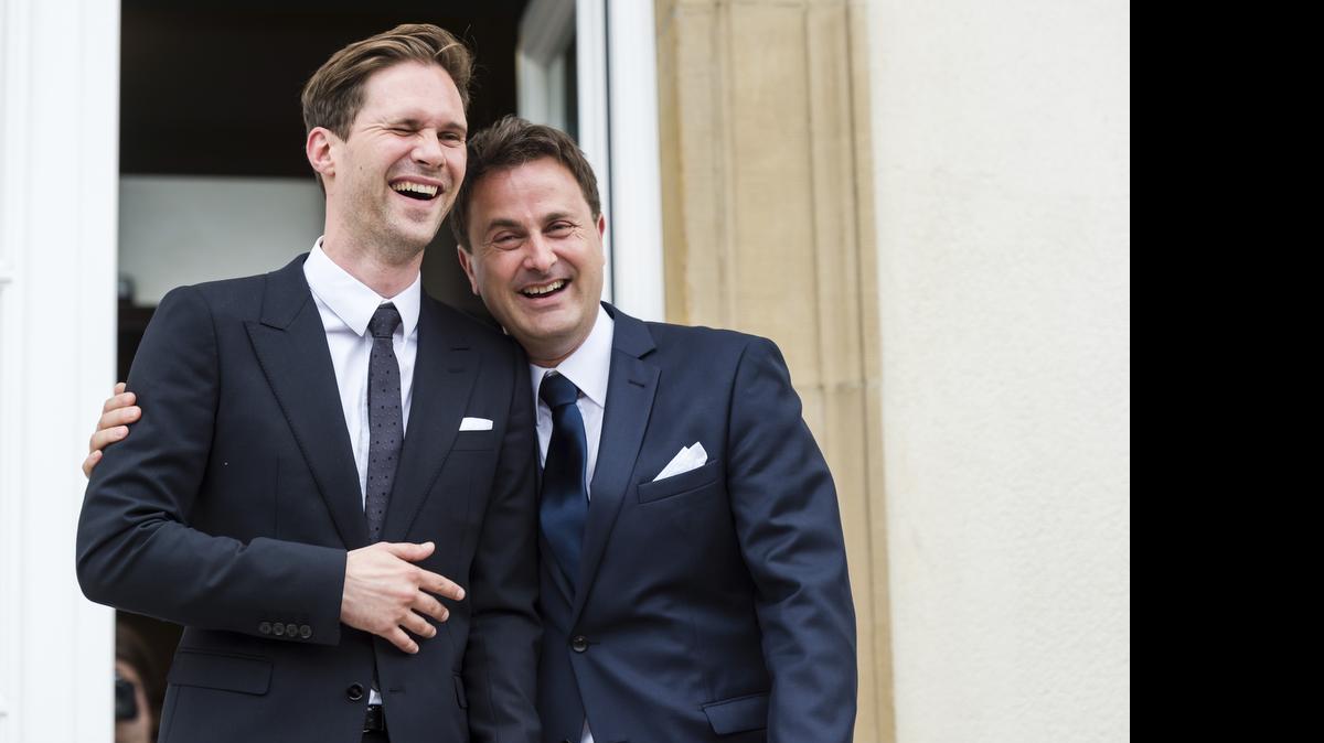 
Luxembourg's Prime Minister Xavier Bettel, right, walks out of the town hall with his partner Gauthier Destenay after their marriage in Luxembourg, on Friday, May 15, 2015. 
