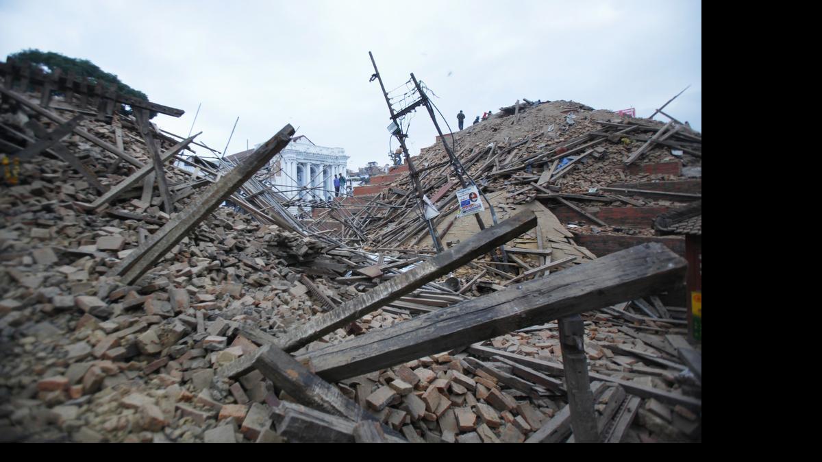 
Debris lie at Durbar Square after an earthquake in Kathmandu, Nepal, Saturday, April 25, 2015. A strong magnitude-7.9 earthquake shook Nepal’s capital and the densely populated Kathmandu Valley before noon Saturday, causing extensive damage with toppled walls and collapsed buildings, officials said. 
