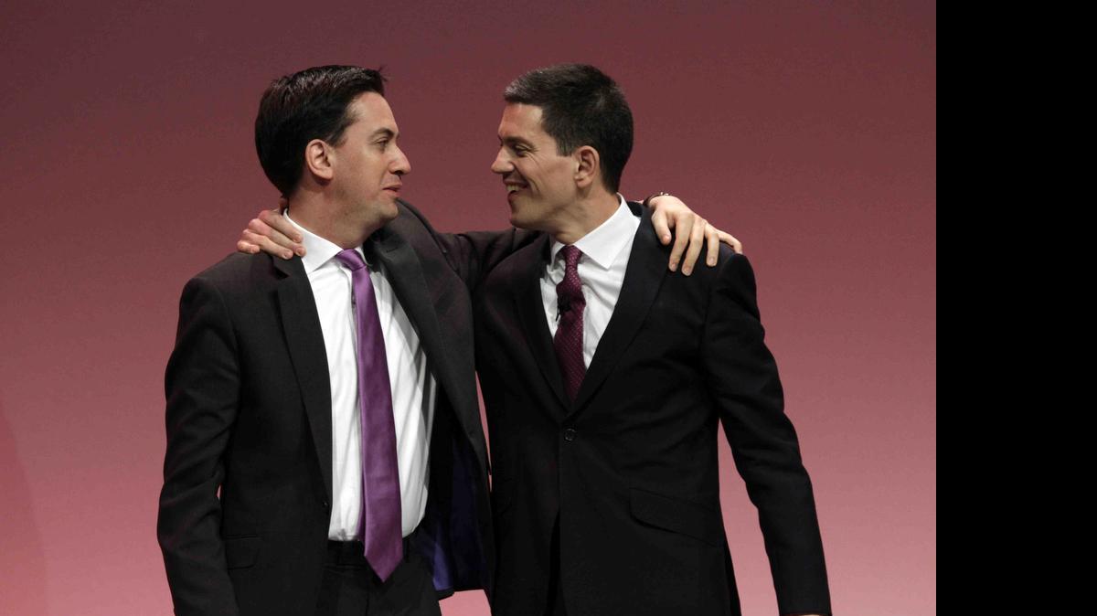 
Ed Miliband, left, the then newly-elected leader of Britain's opposition Labour Party, embraces his brother David Miliband, right, following David's speech on foreign policy during the party's annual conference, in Manchester, England on Sept. 27, 2010. 

