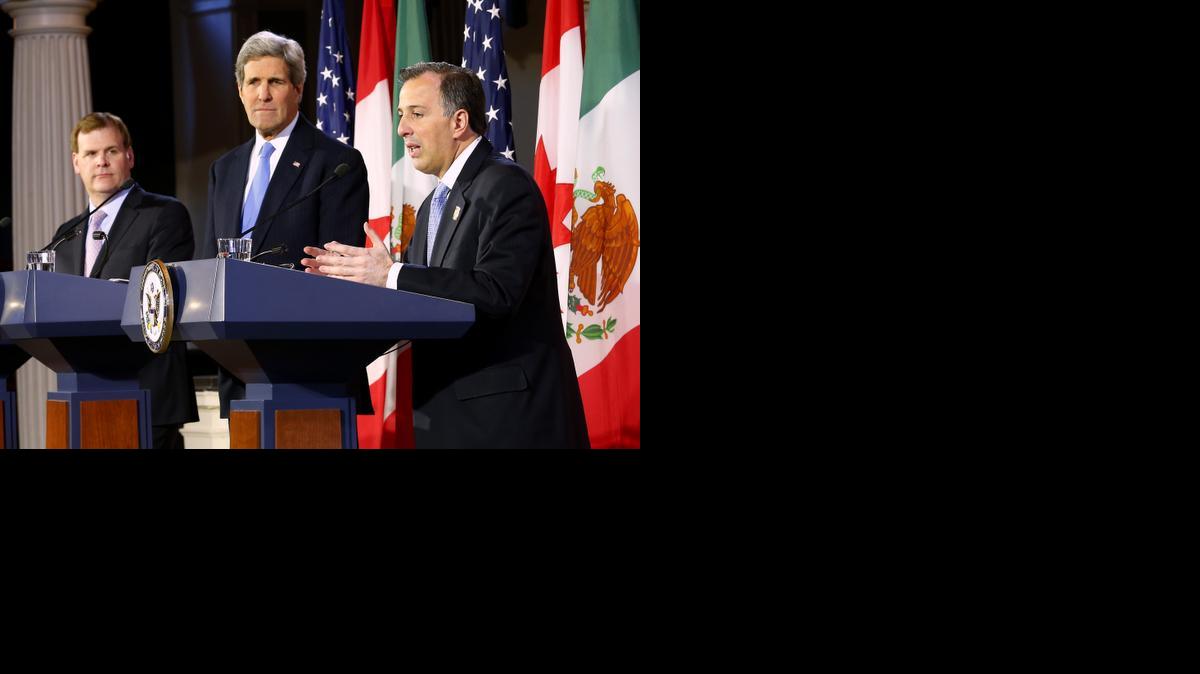 
U.S. Secretary of State John Kerry, center, listens with Canadian Foreign Minister John Baird, left, as Mexican Foreign Secretary Jose Antonio Meade speaks during a news conference at Faneuil Hall in Boston Saturday, Jan. 31, 2015. 
