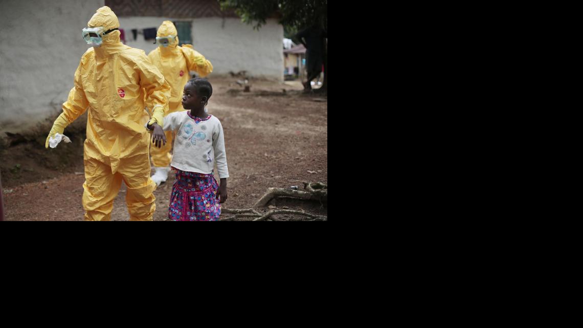 
Nine-year-old Nowa Paye is taken to an ambulance after showing signs of the Ebola infection in the village of Freeman Reserve, about 30 miles north of Monrovia, Liberia, on Sept. 30. An experimental antiviral drug shows some early, encouraging signs of effectiveness in its first human tests against Ebola in West Africa, but only if patients get it when their symptoms first appear.
