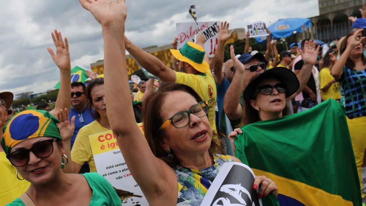 Demonstrators singing the Brazilian national anthem during a demonstration for the impeachment of Brazil’s President Dilma Rousseff, in the center of Brasilia on Sunday, Dec. 13, 2015. Dozens of cities are staging protests across Brazil asking Congress to impeach President Dilma Rousseff. Hundreds have gathered Sunday in cities such as Brasilia, Rio de Janeiro and Sao Paulo wearing Brazil’s national soccer jersey. They are holding banners that criticize the president and her Workers’ Party for a massive corruption scandal at the state-run oil company.