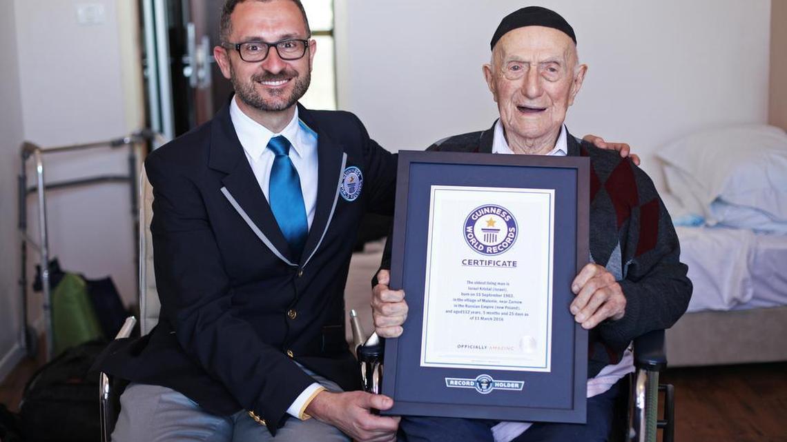 Marco Frigatti, Head of Records for Guinness World Records,presents Israel Kristal a certificate for being the oldest living man in Haifa, Israel, on Friday, March 11, 2016. Guinness said in a statement that Kristal is 112 years and 178 days old as of March 11. Guinness said Kristal was born in 1903 to an Orthodox Jewish family near the town of Zarnow in Poland. However, Susannah Mushatt Jones, an American who is 115, is both the oldest living person and the oldest living woman.