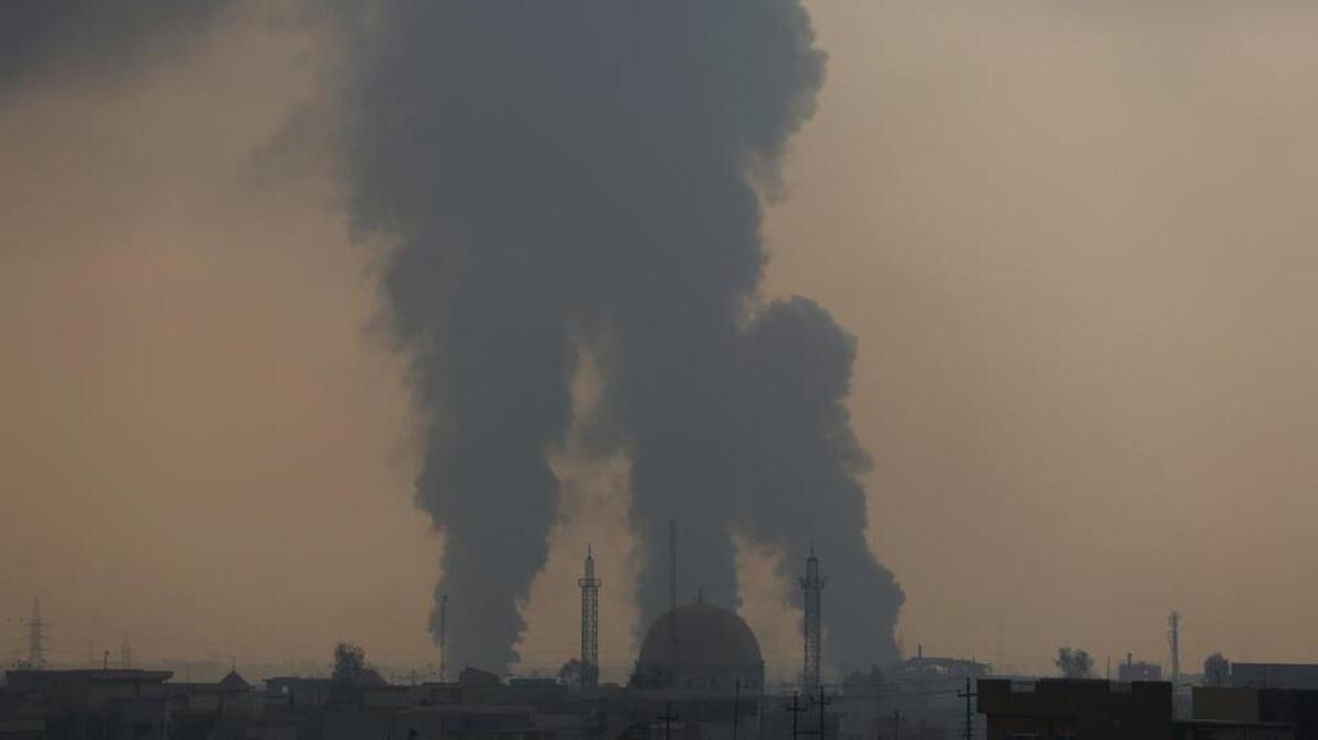 Smoke rises as Iraq's elite counterterrorism forces fight against Islamic State militants to regain control of the al-Bakr neighborhood in Mosul, Iraq, Monday, Dec. 12, 2016.