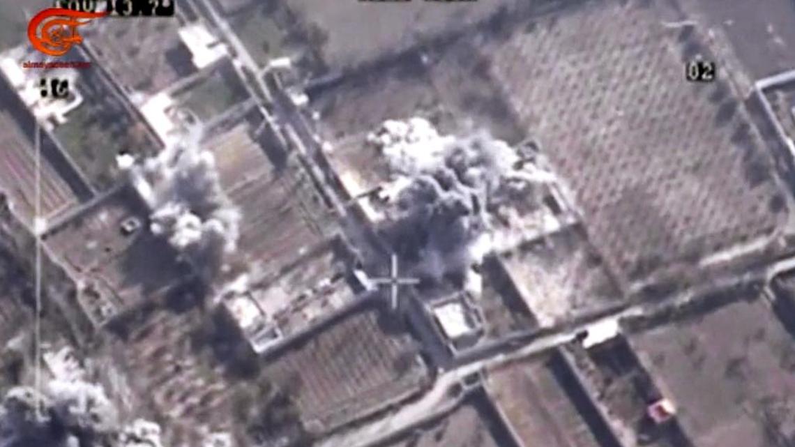 This image made from video made available on Saturday, Dec. 26, 2015, by Al-Mayadeen, government-controlled Syrian Television, which has been verified and is consistent with other AP reporting shows, drone footage allegedly showing Syrian army airstrikes targeting Zahran Allouch, the head of the Army of Islam group near Damascus, Syria. Militant groups in Syria on Saturday mourned the death of a powerful rebel commander who was killed in an airstrike near Damascus – a high profile assassination that may shift the balance of power in rebel-held suburbs of the Syrian capital. Allouch, was killed Friday, Dec. 25 in an airstrike that targeted the group’s headquarters during a meeting.