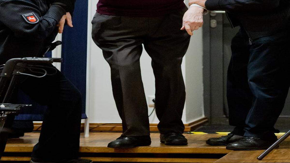 
Former SS guard Oskar Groening is helped into the court room prior to the trial against him in Lueneburg, northern Germany, April 23, 2015. Groening, 93, is accused of helping to operate the death camp Auschwitz in Nazi-occupied Poland between May and June 1944, when some 425,000 Jews from Hungary were brought there and at least 300,000 were almost immediately gassed.
