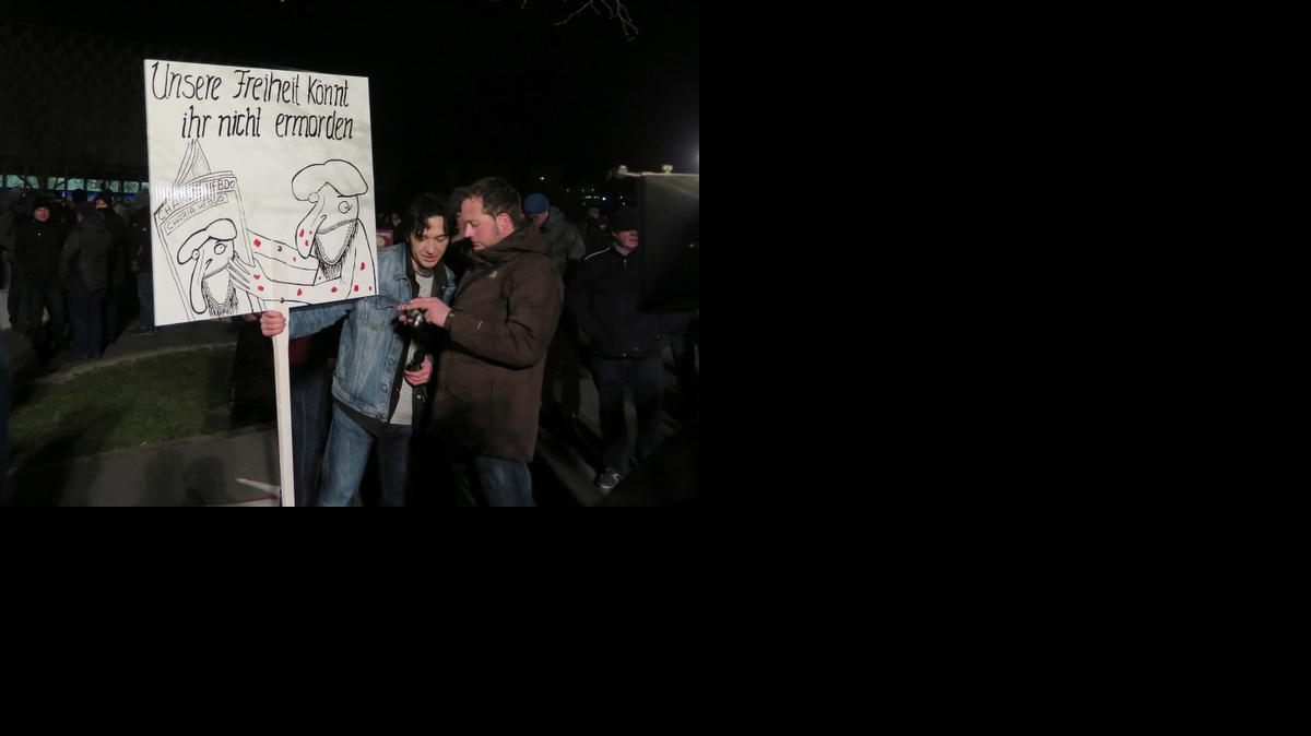 
Peter Schmidt from Klingenthal, Saxony, holds a sign saying “You cannot kill our freedom,” which he said was an homage to Charlie Hebdo, on Monday at a rally in Dresden.
