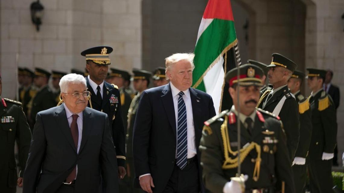 Palestinian President Mahmoud Abbas and President Donald Trump review a Palestinian honor guard in the West Bank city of Bethlehem on Tuesday, May 23, 2017.