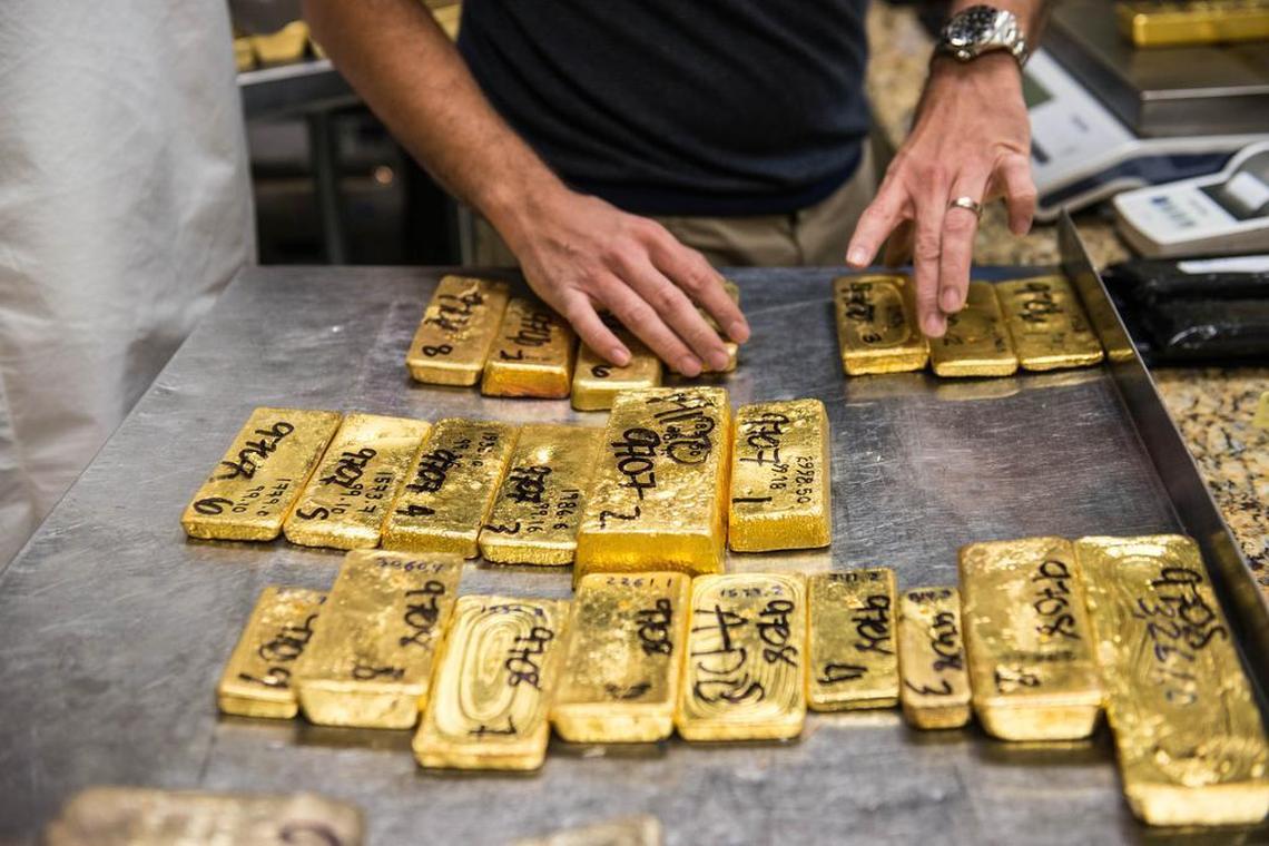 Gold bullion is invoiced prior to testing for purity at a trading house in downtown Miami’s jewelry and diamond district on Friday, Dec. 12, 2014.