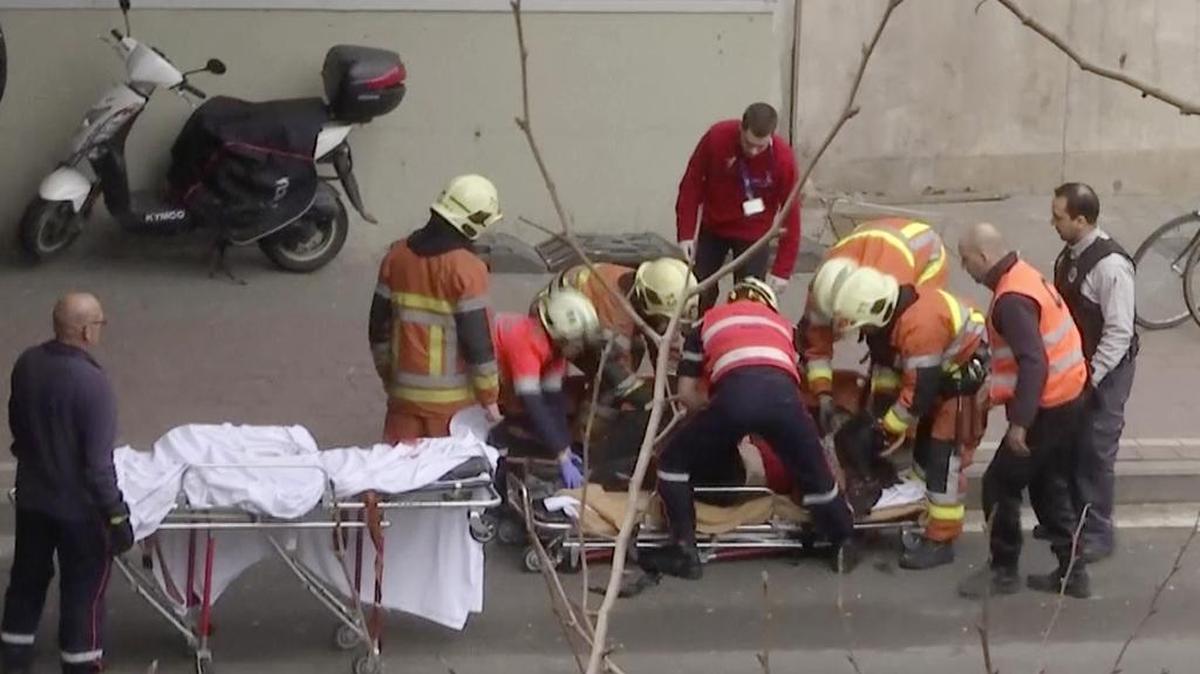 In this image made from video, emergency rescue workers stretcher an unidentified person at the site of an explosion at a metro station in Brussels, Belgium, March 22, 2016.