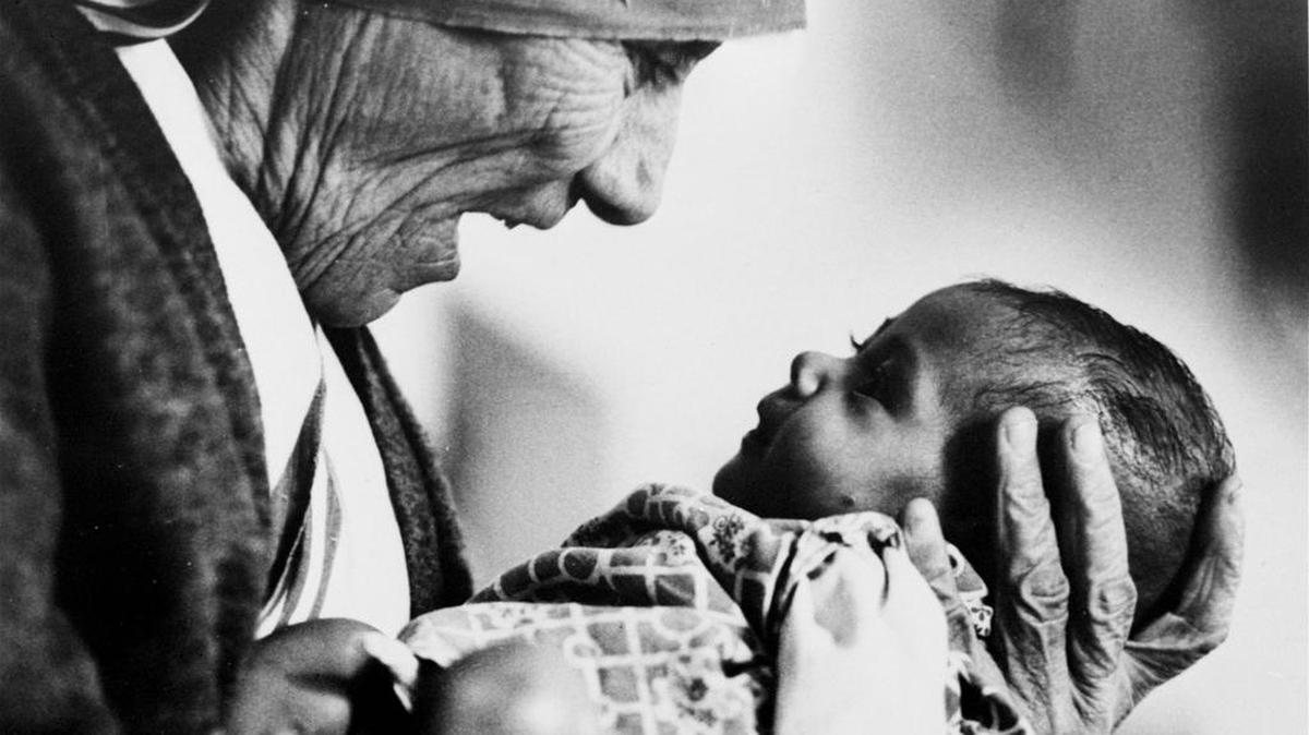 In this 1978, file photo, Mother Teresa, head of the Missionaries of Charity order, cradles an armless baby girl at her order's orphanage in what was then known as Calcutta, India, in 1978.