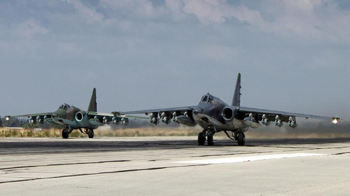 
Two Russian SU-25 ground attack aircraft are shown taking off from an airbase in Hmeimim, Syria in an image taken from video posted Tuesday on the Russian Defense Ministry website. 
