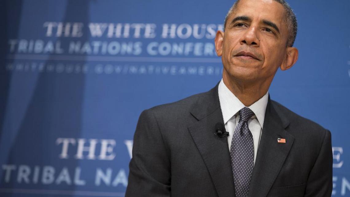 President Barack Obama pauses after speaking at the 2015 White House Tribal Nations Conference, Thursday, Nov. 5, 2015, in Washington. In conjunction with the conference, shoe company and apparel maker Adidas announced it will provide free design resources to schools looking to shelve Native American mascots, nicknames, imagery or symbolism.