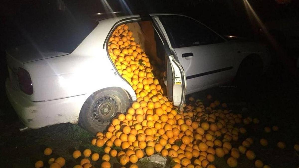 A photo posted to Twitter by Emergencias Sevilla shows a car stuffed with oranges after a police stop near Seville, Spain.