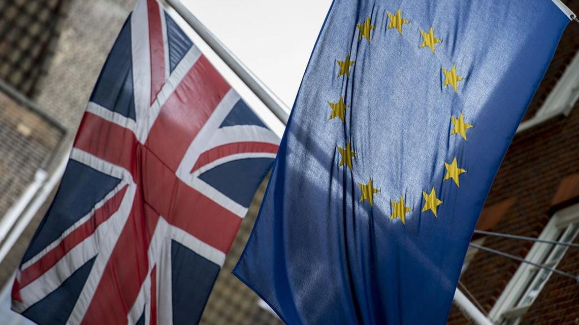 Flags fly outside Europe House, the European Parliament's British offices, in central London, with European flag, right, and Britain's Union flag, Tuesday June 21, 2016.