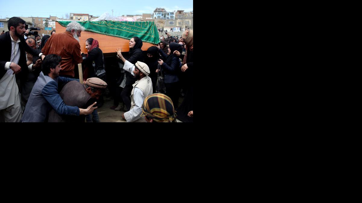 
In this Sunday, March 22, 2015 photo, women’s rights activists carry the coffin of 27-year-old Farkhunda, an Afghan woman who was beaten to death by a mob, during her funeral, in Kabul, Afghanistan. Farkhunda, beaten to death by a frenzied mob apparently in the mistaken belief that she had burned a Quran, has become a rallying cry for Afghans hoping that the shocking incident will lead to profound changes in Afghanistan, routinely listed among the world’s worst places for woman, as well as one of its most corrupt and impoverished. 
