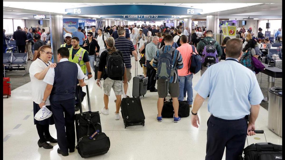 A Calgary mother says her 2-year-old son’s boot became trapped in an escalator Friday at Vancouver International Airport, breaking his leg. This Aug. 31, 2016, photo of the Fort Lauderdale-Hollywood International Airport in Fort Lauderdale, Fla., is unrelated to the story.