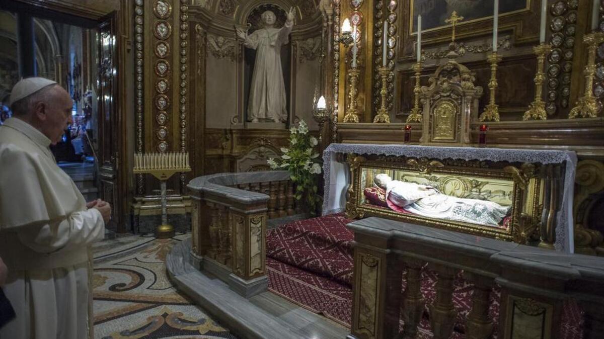 Pope Francis prays in front of the tomb of St. John Bosco in the Santa Maria Ausiliatrice Basilica of Turin, northern Italy. A relic containing pieces of St. John Bosco’s brain was stolen from the Don Bosco Basilica.