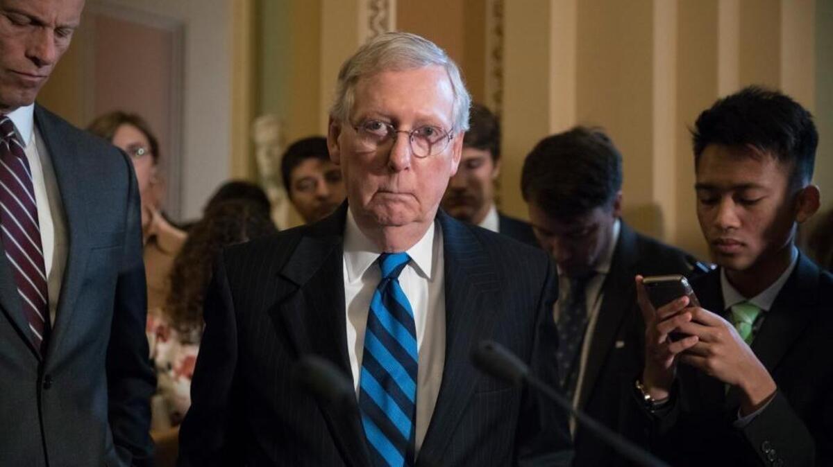 Senate Majority Leader Mitch McConnell of Kentucky, joined by Sen. John Thune, R-S.D., left, the Republican Conference chairman, meets with reporters after a closed-door Republican strategy session, Tuesday, July 11, 2017, on Capitol Hill in Washington. McConnell said Senate Republicans will begin voting on their revised health care bill next week.
