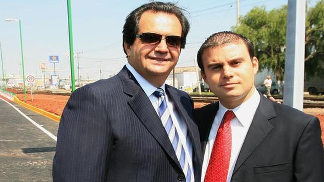 Mexican tycoon Juan Armando Hinojosa Cantú and his son, Juan Armando Hinojosa García, appear at the inauguration of a highway public works project near Toluca, Mexico, on April 30, 2008. The father, a contractor whose conglomerate has won scores of public contracts in the past decade, has seen his wealth soar under the wing of President Enrique Peña Nieto. The son died in a helicopter crash in July 2012.