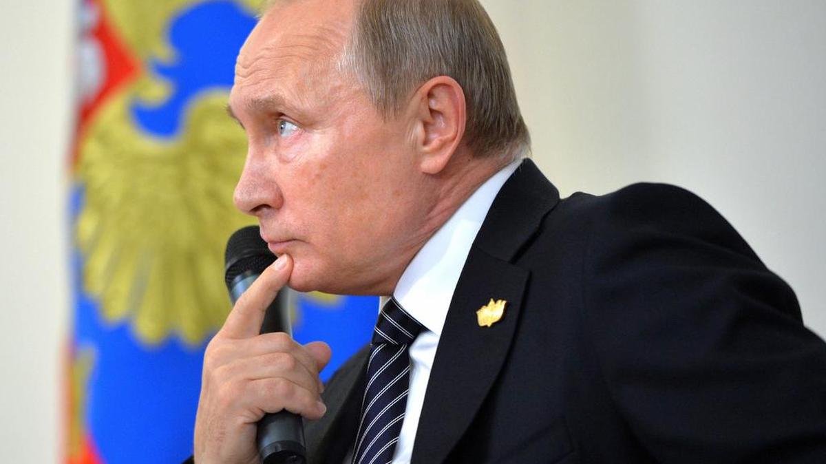 Russian President Vladimir Putin listens for a question while speaking to Russian journalists during a news conference Sunday, Oct. 16, 2016. Republican presidential candidate Donald Trump said Monday he would be willing to meet with Putin before his inauguration if he wins the election.