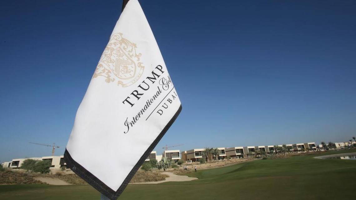 A flag flies in late 2016 on a green lined with villas at the Trump International Golf Club, in Dubai, United Arab Emirates. The 18-hole golf course in Dubai bearing Donald Trump’s name exemplifies the questions surrounding his international business interests.
