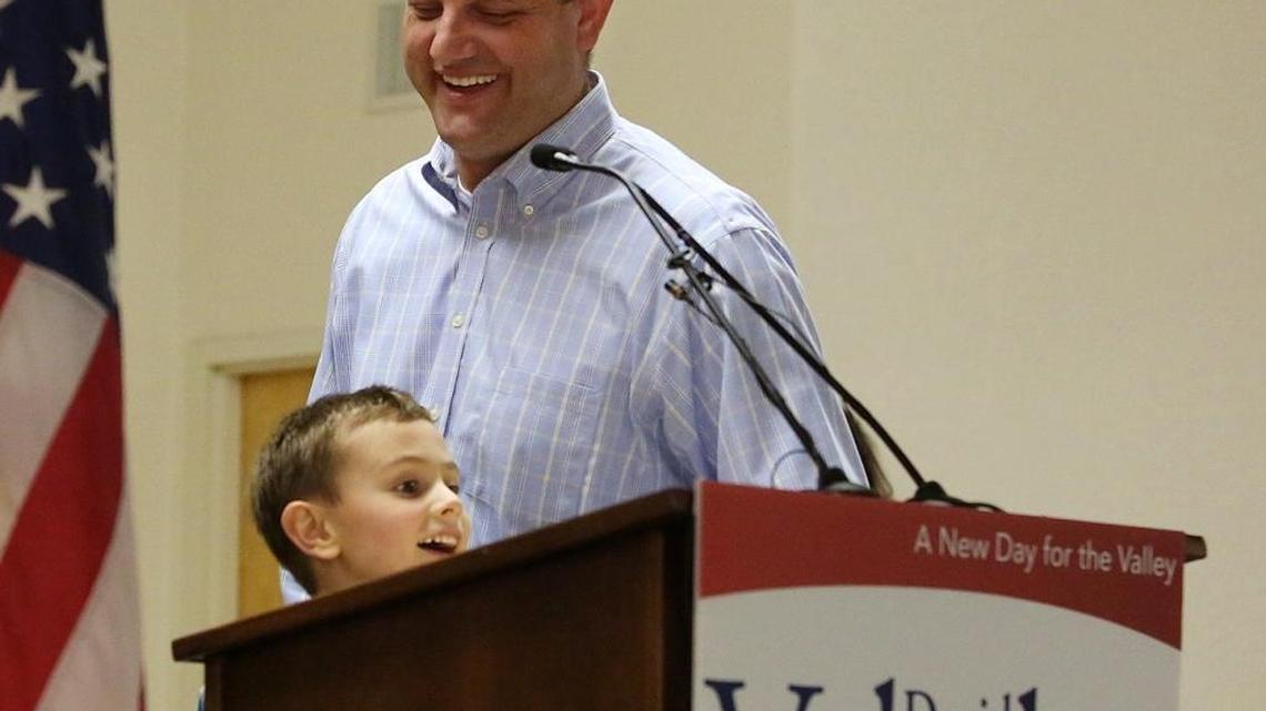 Rep. David Valadao watches his son Lucas take the podium. Valadao, R-Calif., is one of the nation’s most vulnerable House Republicans in the upcoming November election.