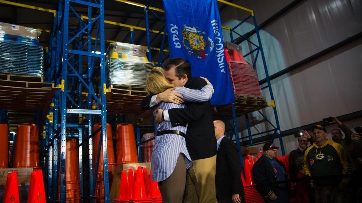 Republican presidential candidate Sen. Ted Cruz, R-Texas, hugs his wife, Heidi Cruz, before speaking at a campaign stop, Friday, March 25, 2016, in Oshkosh, Wis.