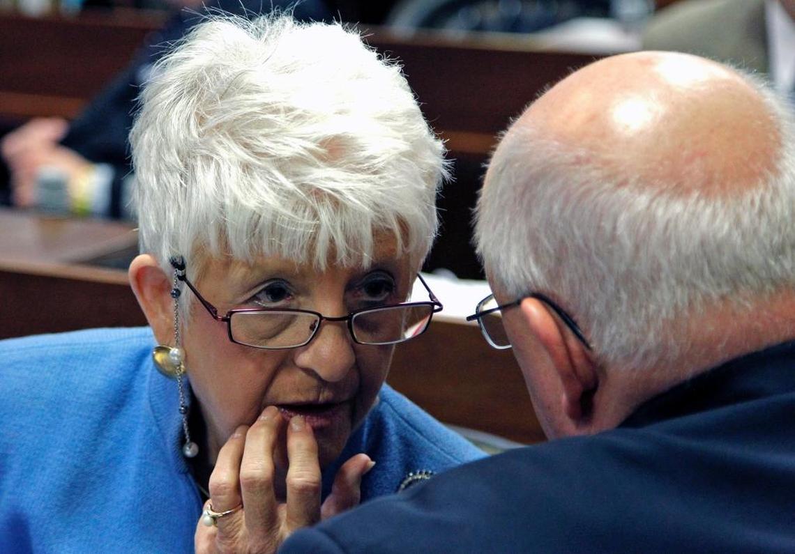 In this file photo, Rep. Julia Howard, left, talks to Rep. William Brawley on the House floor in Raleigh on July 31, 2014.
