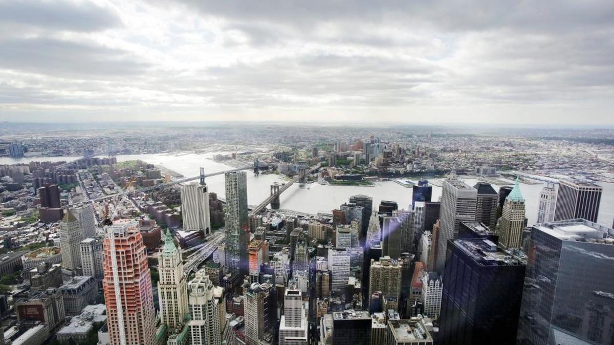 This May 20, 2015, file photo, shows New York's Financial District, foreground, the Brooklyn Bridge and East River, center, and in the distance Brooklyn as seen from the observatory at One World Trade Center. Republican presidential candidates are working hard for delegates, a handful of New York voters at a time.