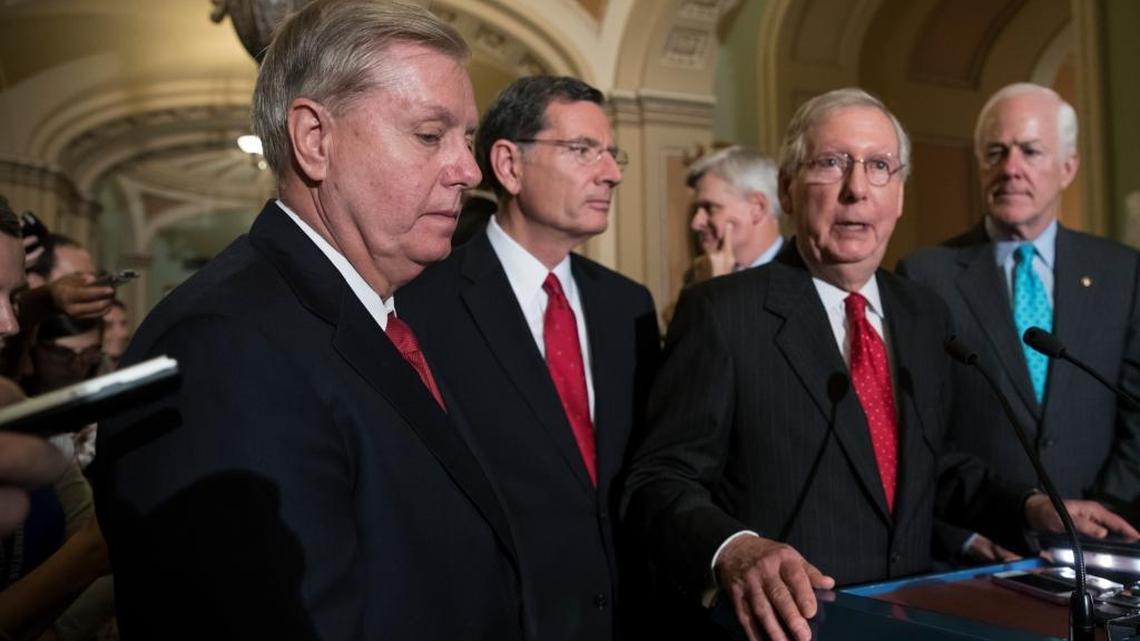 From left, Sen. Lindsey Graham, R-S.C., Sen. John Barrasso, R-Wyo., Sen. Bill Cassidy, R-La., Senate Majority Leader Mitch McConnell, R-Ky., and Majority Whip John Cornyn, R-Texas, speak to reporters as they faced assured defeat on the GOP's latest attempt to repeal the Obama health care law.