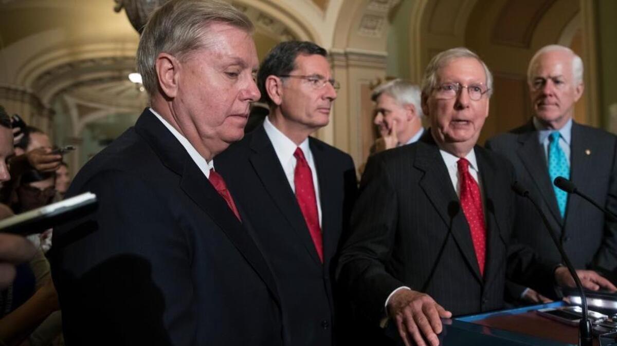 From left, Sen. Lindsey Graham, R-S.C., Sen. John Barrasso, R-Wyo., Sen. Bill Cassidy, R-La., Senate Majority Leader Mitch McConnell, R-Ky., and Majority Whip John Cornyn, R-Texas, speak to reporters as they faced assured defeat on the GOP's latest attempt to repeal the Obama health care law.