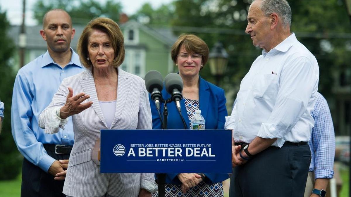 House Minority Leader Nancy Pelosi of Calif., accompanied by, from left, Rep. Hakeem Jeffries, D-N.Y., Sen. Amy Klobuchar, D-Minn. and Senate Minority Leader Chuck Schumer of N.Y. speaks in a park in Berryville, Va., Monday, where they unveiled the Democrats’ new agenda.