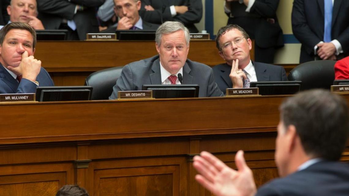Republican House Oversight Committee and Government Reform Committee members, from left, Rep. Ron DeSantis, R-Fla., Rep. Mark Meadows, R-N.C., and Rep. Thomas Massie, R-Ky., listen on Capitol Hill in Washington, Thursday, July 7, 2016, as FBI Director James Comey, right, testifies before the committee's hearing to explain his agency's recommendation to not prosecute Democratic presidential candidate Hillary Clinton over her private email setup during her time as secretary of state.