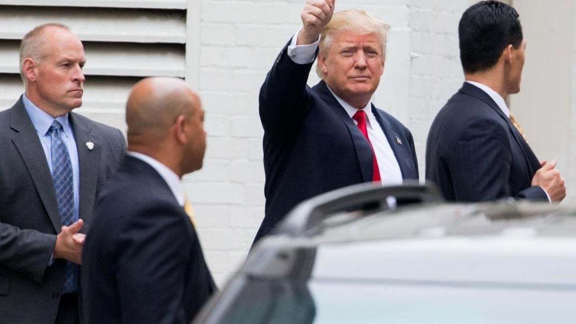 Republican presidential candidate Donald Trump waves as he arrives for a meeting with House Speaker Paul Ryan of Wisconsin, at the Republican National Committee headquarters on Capitol Hill in Washington, Thursday, May 12, 2016.