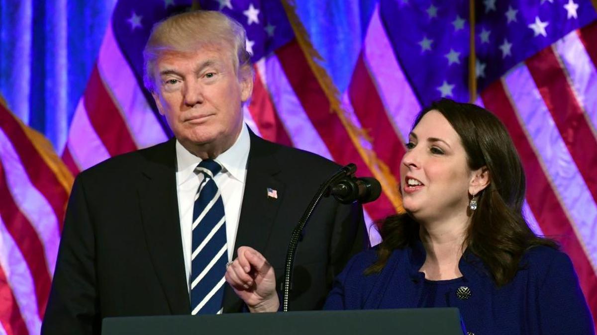 President Donald Trump, left, listens as Republican National Committee chairwoman Ronna Romney McDaniel, right, speaks at a fundraiser at Cipriani in New York, Saturday, Dec. 2, 2017.