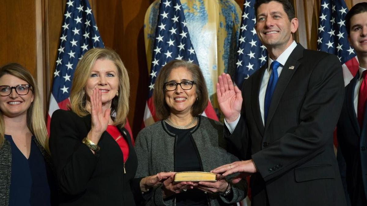 House Speaker Paul Ryan of Wis. administers the House oath of office to Rep. Marsha Blackburn, R-Tenn., during a mock swearing in ceremony on Capitol Hill in Washington on Jan. 3. Both are being targeted by activists upset by recent Congressional votes that would allow internet service providers to sell consumers’ internet history without any permission.