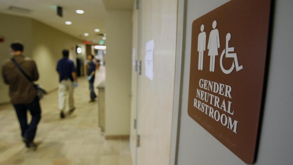 In this Aug. 23, 2007, photo, a sign marks the entrance to a gender neutral restroom at the University of Vermont in Burlington. In clashes over transgender students and which restrooms and locker rooms they should use, the U.S. Department of Education has warned public schools that a sex discrimination law makes it illegal to deny them access to the facilities of their choice.