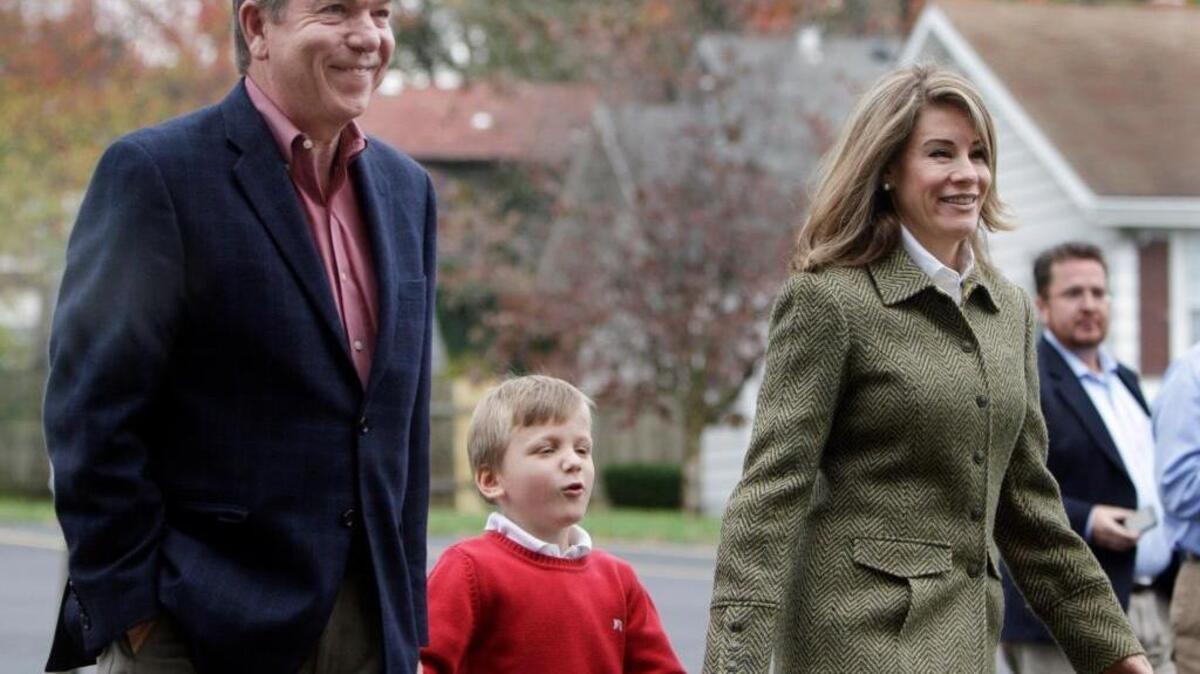Missouri Republican U.S. Senate candidate Roy Blunt, left, and his wife Abigail Blunt walk into their polling place to vote along with their 5-year-old son Charlie on Nov. 2, 2010, in Springfield, Mo.