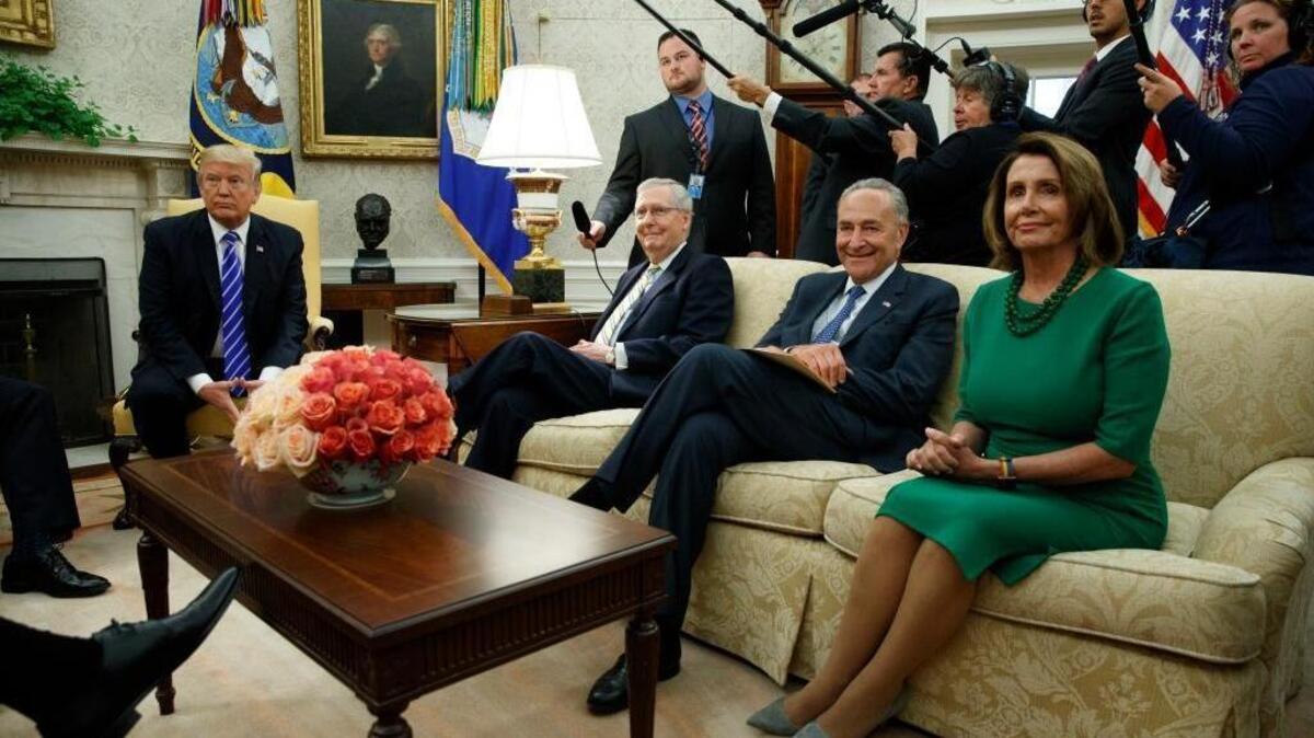 President Donald Trump meets with, from left, Senate Majority Leader Mitch McConnell, R-Ky., Senate Minority Leader Chuck Schumer, D-N.Y., and House Minority Leader Nancy Pelosi, D-Calif., and other Congressional leaders in the Oval Office of the White House, Wednesday, Sept. 6, 2017, in Washington.
