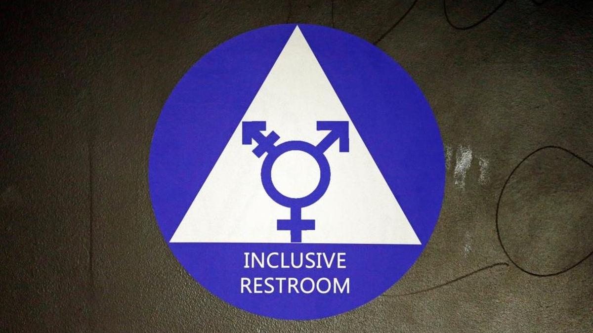 A new sticker designates a gender-neutral bathroom at Nathan Hale high school Tuesday, May 17, 2016, in Seattle. President Obama’s directive ordering schools to accommodate transgender students has been controversial in some places but Seattle has mandated that transgender students be able to use of the bathrooms and locker rooms of their choice since 2012.