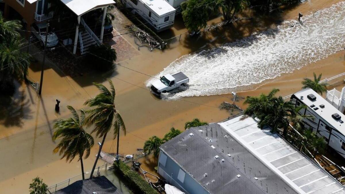 A truck drives through a flooded street in the aftermath of Hurricane Irma, Monday in Key Largo, Fla.